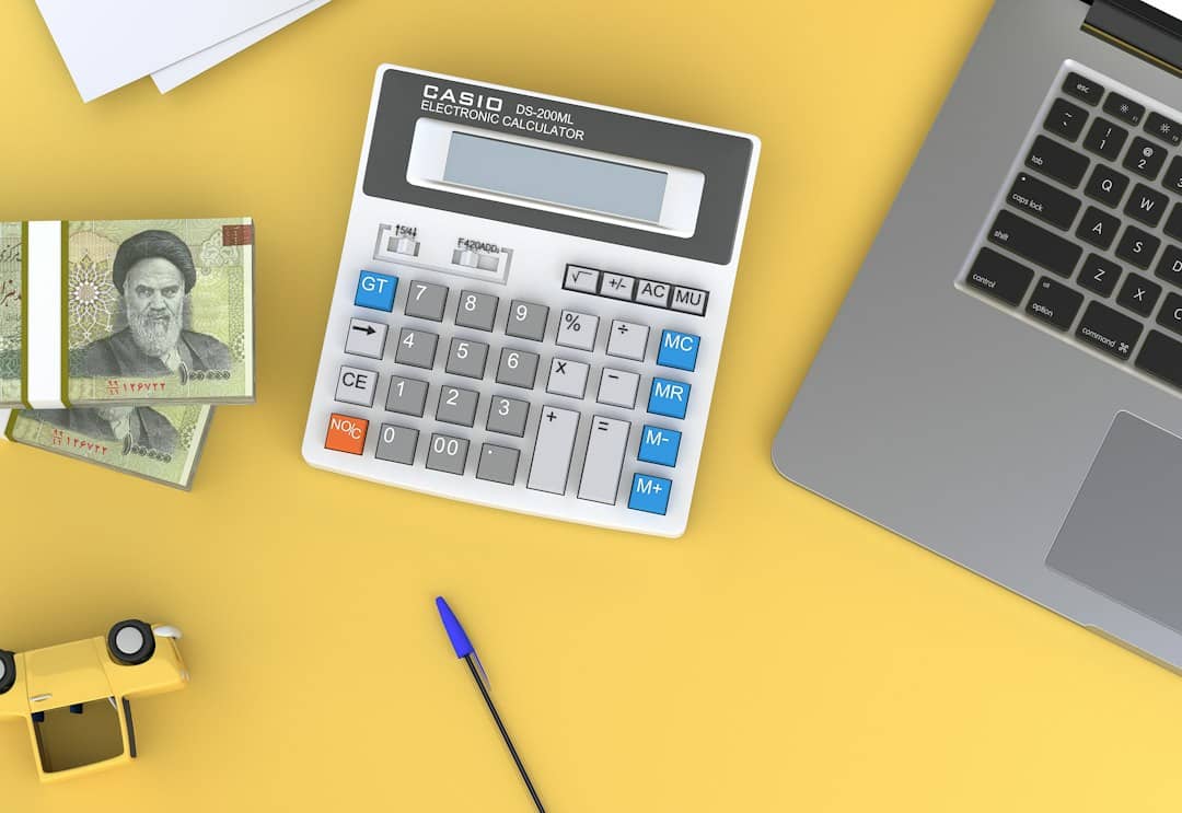 Financial documentation, cost calculator, and mortgage files on a desk